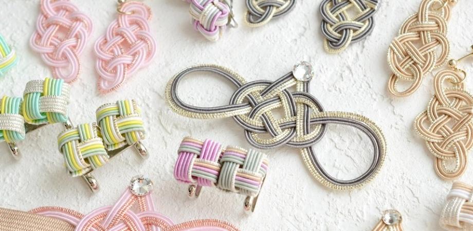 Handmade mizuhiki cord earrings and accessories on display in Kobe